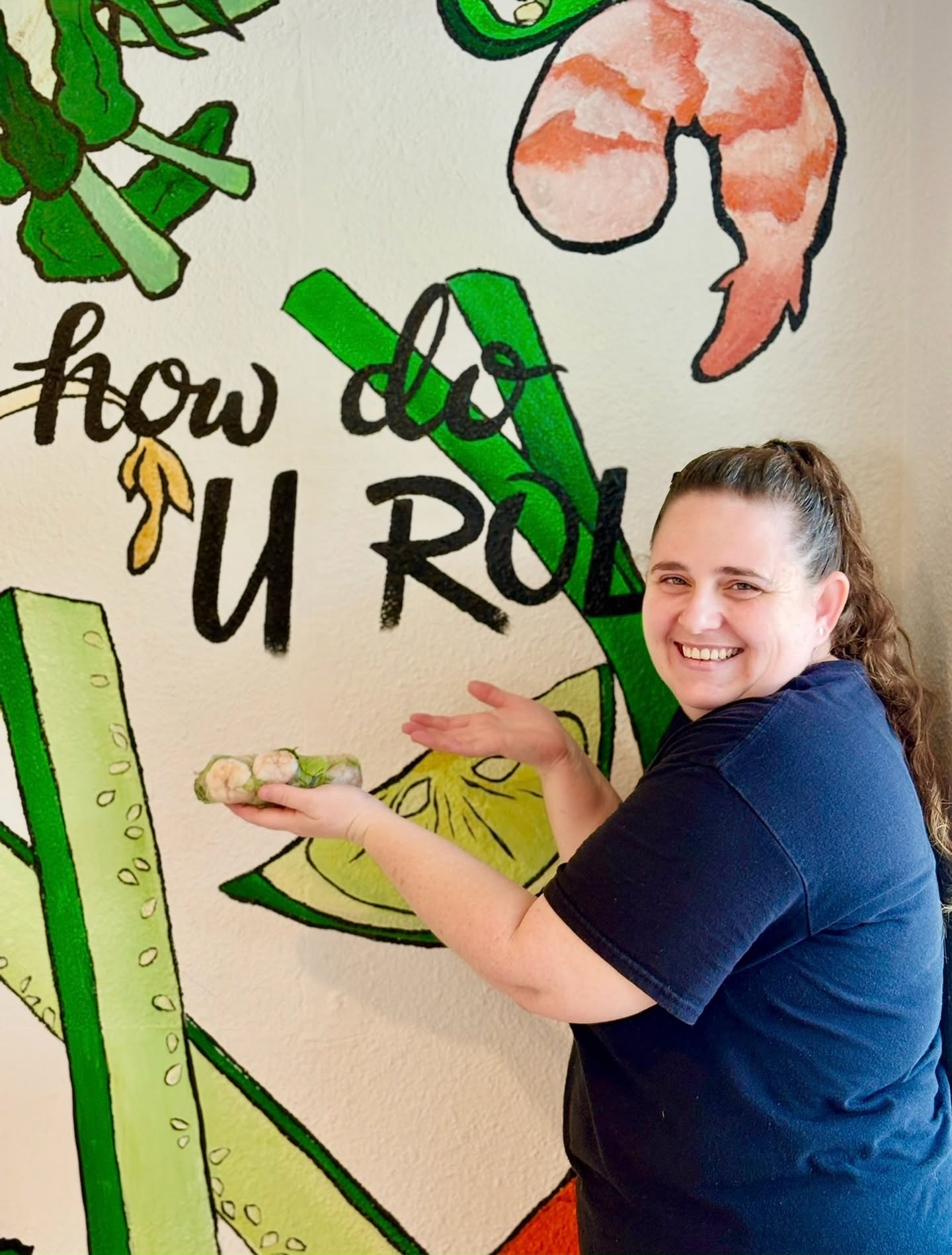 A V-Roll team member at the how do U roll? mural