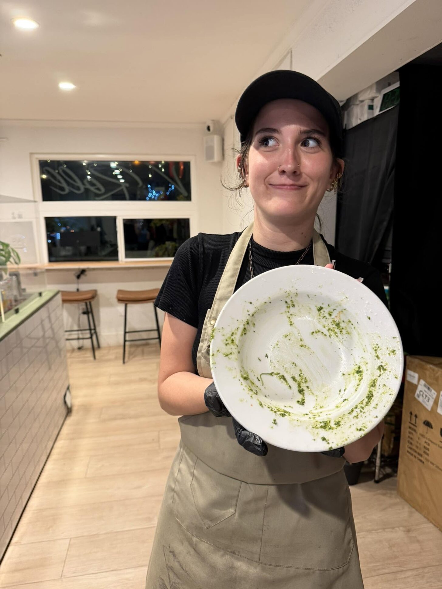 A V-Roll team member holding up a plate wiped clean