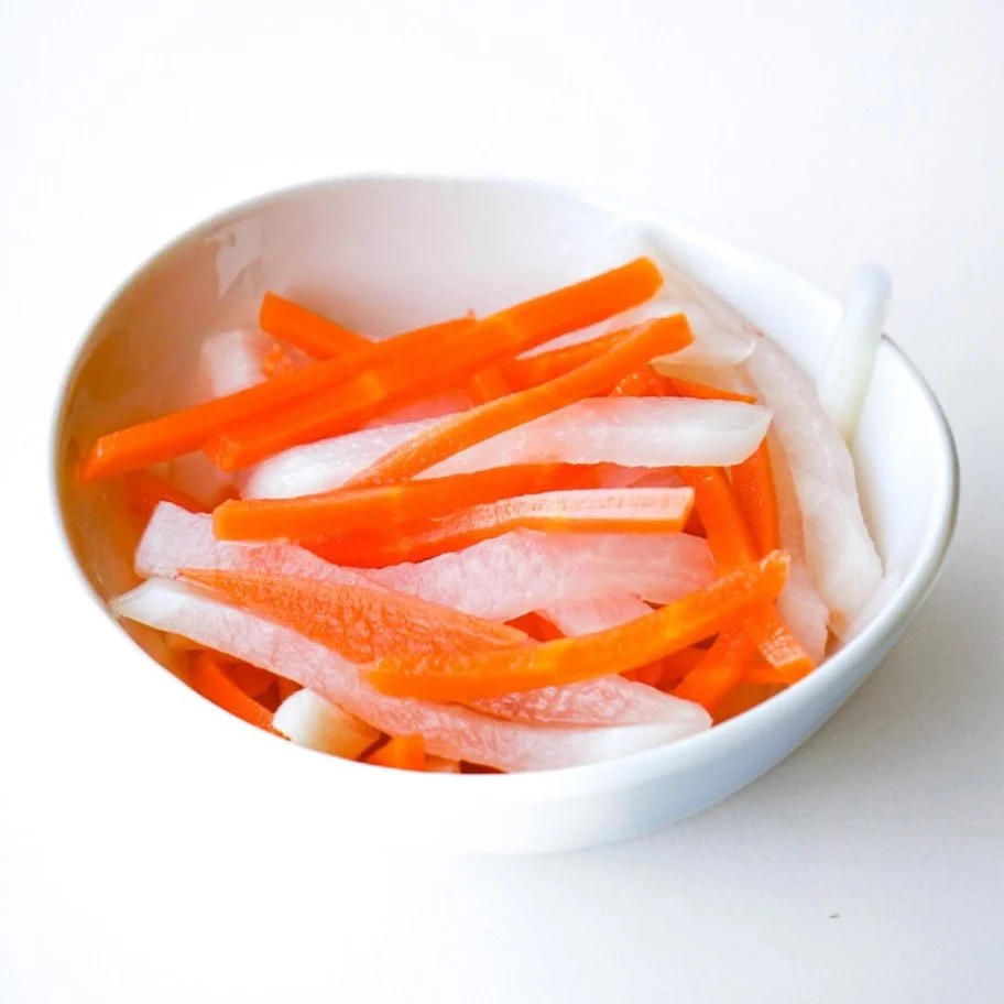 Pickled carrots & daikon, from above in a white dish
