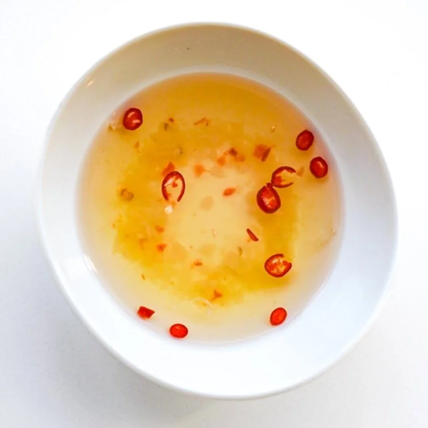 Citrus garlic sauce (Nước Chấm), from above in a white dish